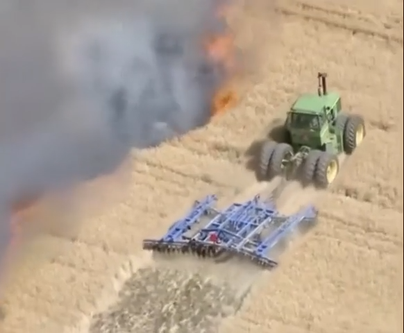 A farmer trying to save his neighbor's field from fire in Weld County, Colorado.Once alarmed, he ran home and grabbed his equipment to help out. thumbnail