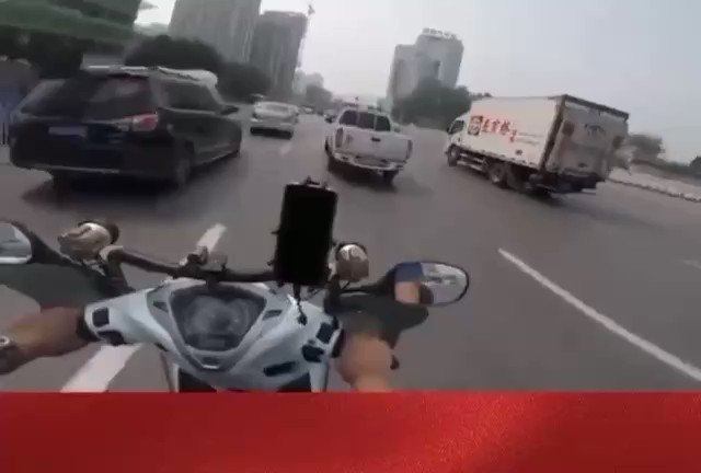 Over in China, a motorcyclist spotted a cop texting while driving without a seatbelt. And so, he pulled him over and flipped his lid on him thumbnail
