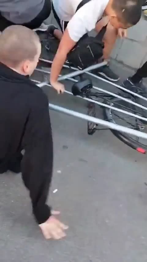People fall 5 feet backwards onto concrete and no one blinks an eye because the door has opened. What is inside? thumbnail
