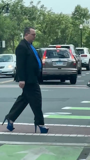 A man in a full suit was spotted casually strutting around in high heels thumbnail