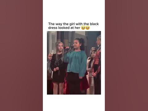 the girl in the black dress could not wait for people to hear her friends lovely voice she is like "guys, isnt she wonderful?" with her proud look! thumbnail