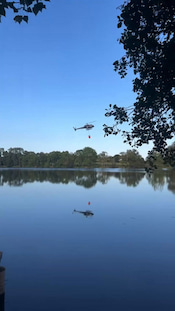 A helicopter fighting a forest fire in France crashed into a lake while attempting to scoop up water!